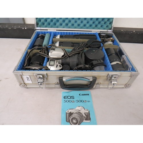 382 - Canon EOS 500 camera with a number of assorted lenses in a metal carry case
