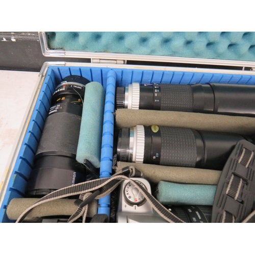 382 - Canon EOS 500 camera with a number of assorted lenses in a metal carry case
