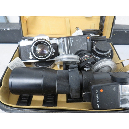 383 - Nikkormat camera with an assortment of lenses