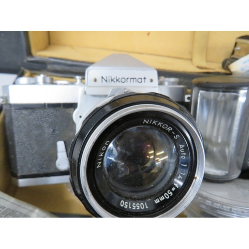 383 - Nikkormat camera with an assortment of lenses
