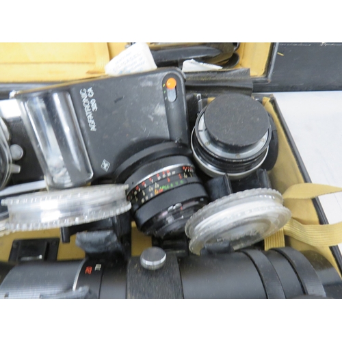 383 - Nikkormat camera with an assortment of lenses