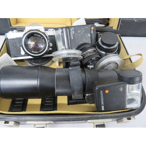 383 - Nikkormat camera with an assortment of lenses