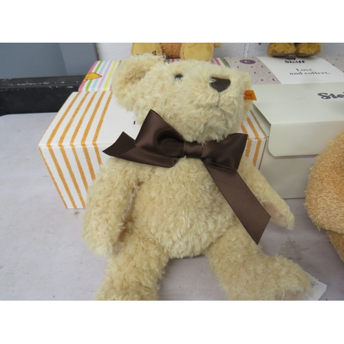 387 - Four boxed Steiff teddies