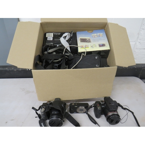 394 - Job lot of assorted cameras to include digital