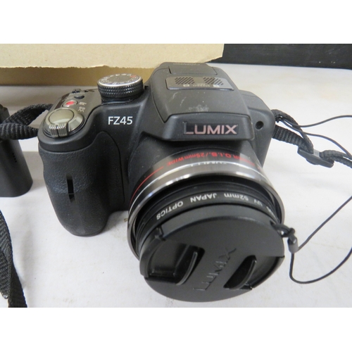 394 - Job lot of assorted cameras to include digital