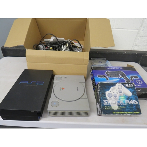 399 - Lot of assorted gaming equiptment to include a PS1 and PS2 console