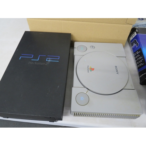 399 - Lot of assorted gaming equiptment to include a PS1 and PS2 console