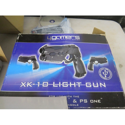 399 - Lot of assorted gaming equiptment to include a PS1 and PS2 console