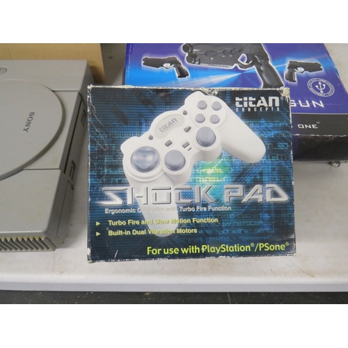 399 - Lot of assorted gaming equiptment to include a PS1 and PS2 console