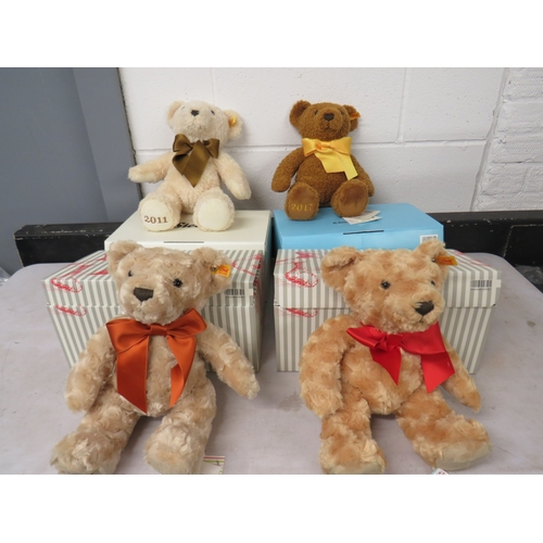 404 - Four boxed Steiff teddies