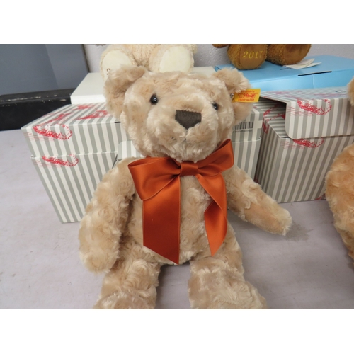 404 - Four boxed Steiff teddies