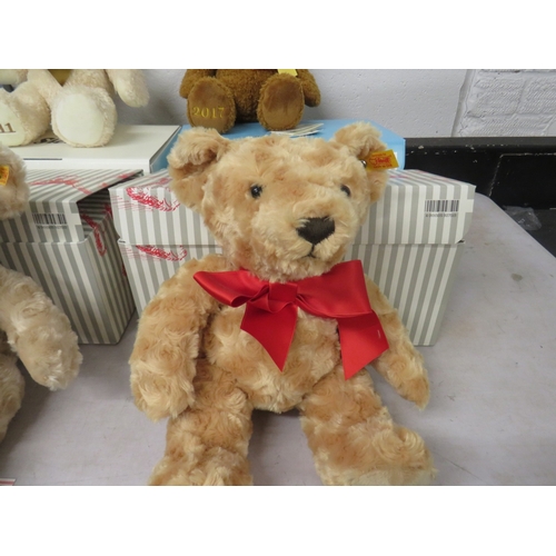 404 - Four boxed Steiff teddies