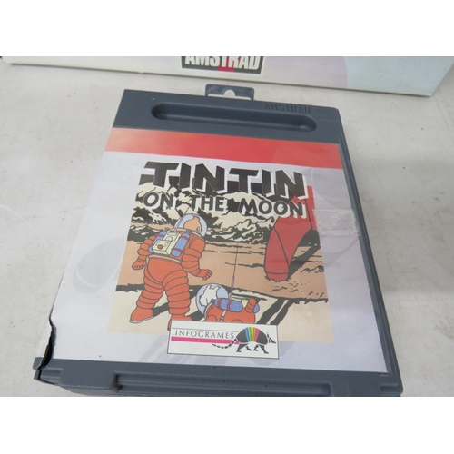 414 - Amstrad GX4000 game system in original box with TinTin on the moon game