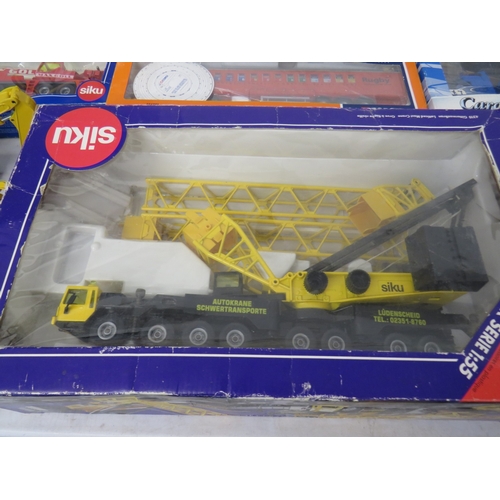 423 - Nine boxed construction vehicles to include Joal, Siku etc