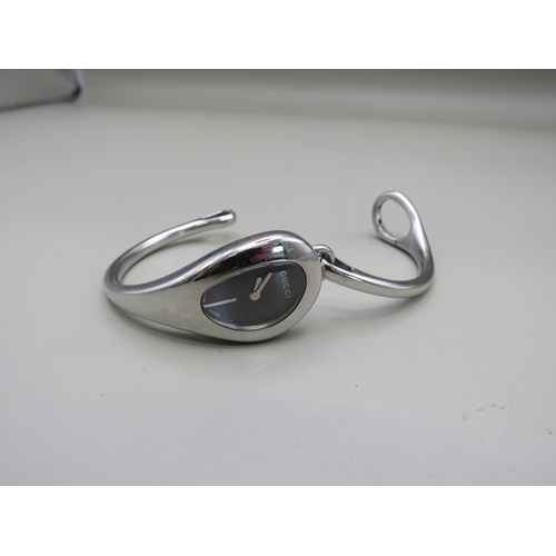 11 - Gucci bangle watch