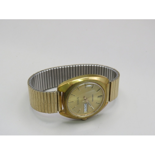 13 - Gold tone Garrard day date watch