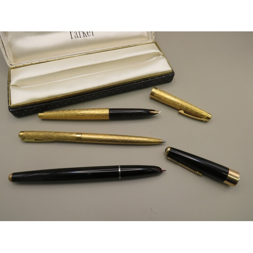 25 - Boxed Parker pen and two other gold tone pens