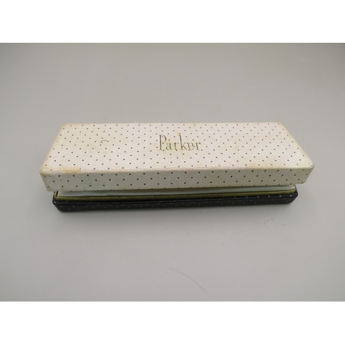 25 - Boxed Parker pen and two other gold tone pens