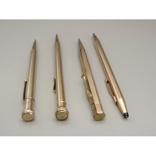 26 - Four vintage gold tone pens/ propelling pencils
