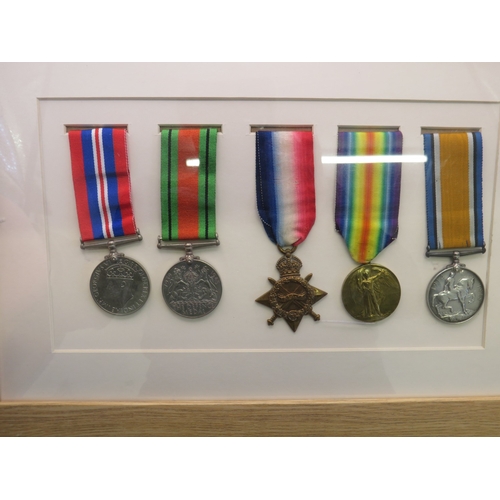 32 - Framed WWI & WWII medal set to include WWI trio awarded to 6279. Pte F.W. Mack. K. O. Sco. Bord.