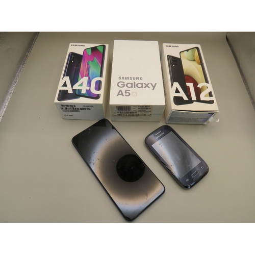 39 - Three boxed samsung phones plus two others - untested