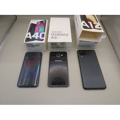 39 - Three boxed samsung phones plus two others - untested