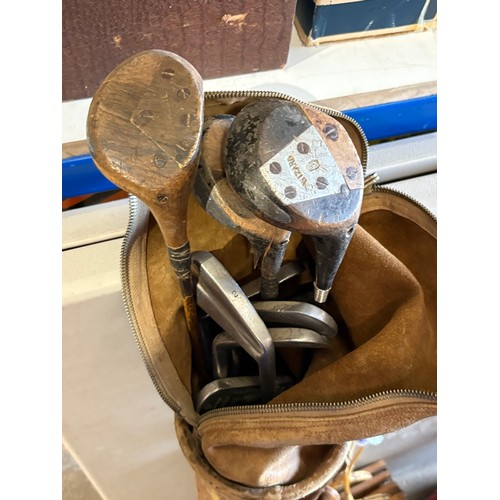 665 - Vintage/antique set of golf clubs, a set of bowls and two vintage tennis rackets