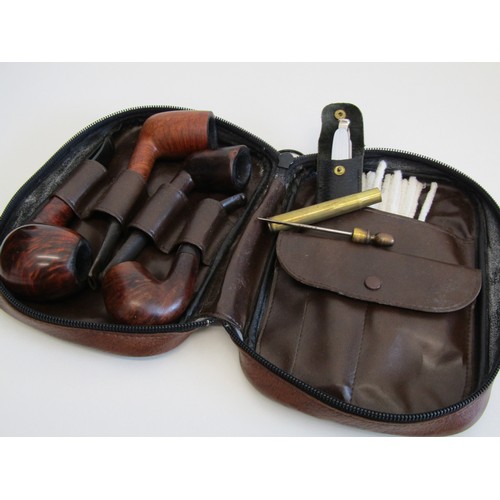 82 - Brown leather pipe tobacco pouch with pipes and accessories.