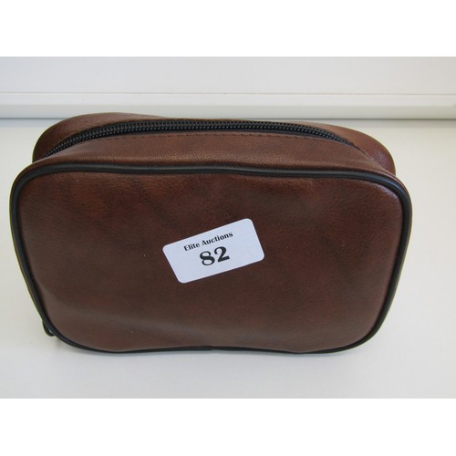 82 - Brown leather pipe tobacco pouch with pipes and accessories.