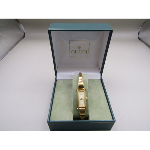 7 - Gold Tone Gucci watch with additional strap