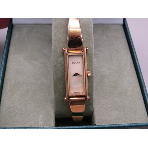 7 - Gold Tone Gucci watch with additional strap