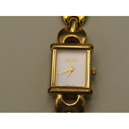 9 - Gold tone Gucci watch