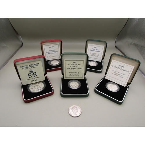 21 - Five cased silver proof coins all with certificates of authenticity