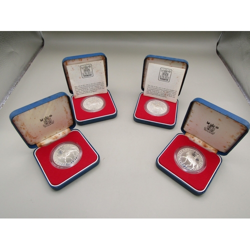 23 - Four cased sterling silver commemorative crowns