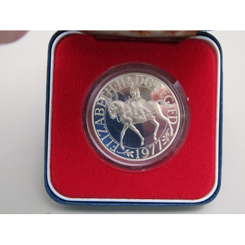 23 - Four cased sterling silver commemorative crowns