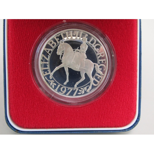 23 - Four cased sterling silver commemorative crowns