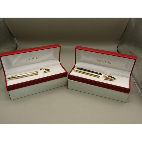 25 - Two boxed Sheaffer pens
