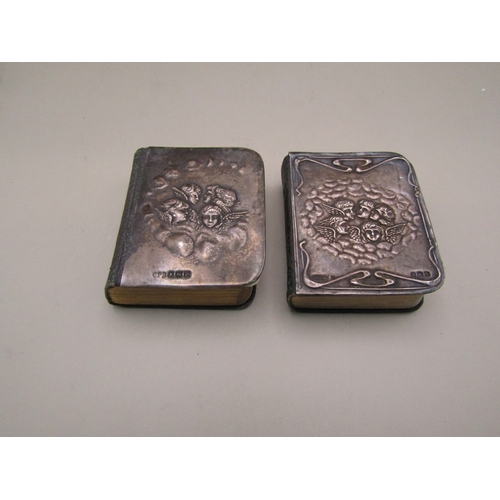 32 - Two miniature bibles with sterling silver cherub covers