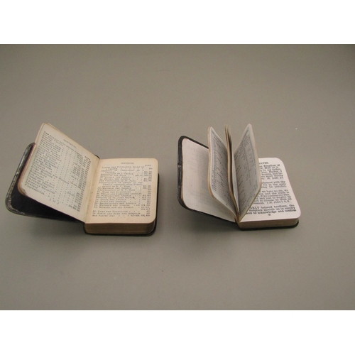 32 - Two miniature bibles with sterling silver cherub covers