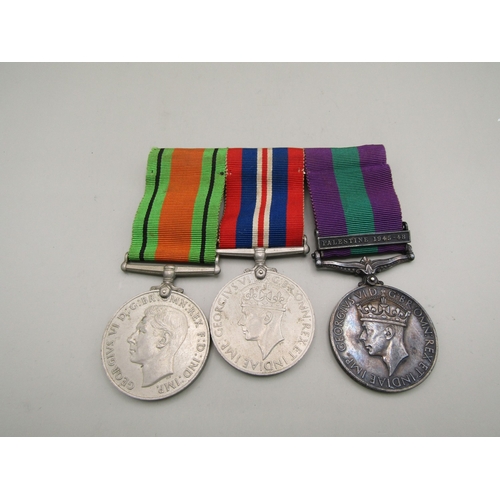 34 - Three medals including two WWII medals and a General Service Medal with Palestine 1945-48 clasp awar... 