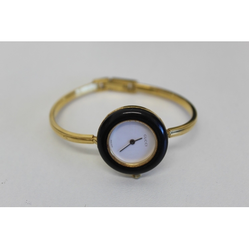 16 - Gucci wristwatch with twelve different coloured bezels