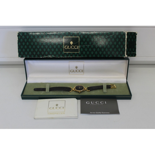 17 - Cased Gucci watch