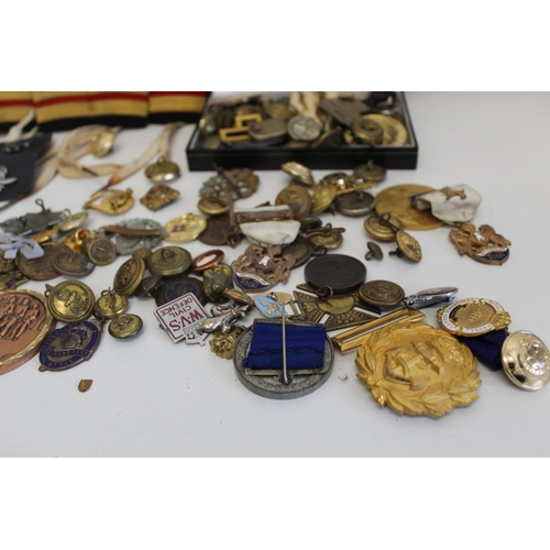 33 - Job lot of assorted badges largely consisting of military
