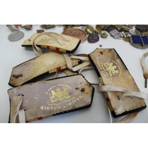 33 - Job lot of assorted badges largely consisting of military
