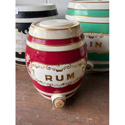 339A - Set of four ceramic alcohol barrels to include Sherry and Gin