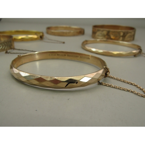27 - Six gold plated/rolled gold bangles