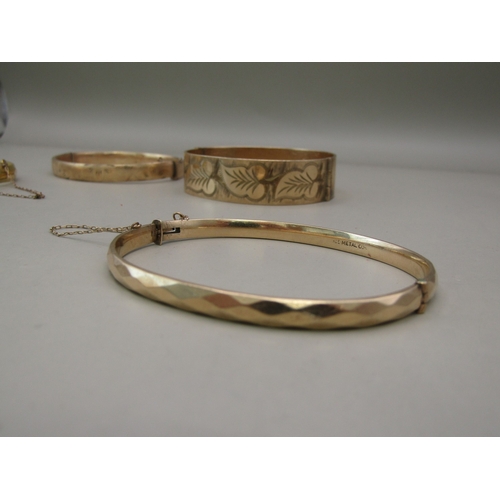 27 - Six gold plated/rolled gold bangles