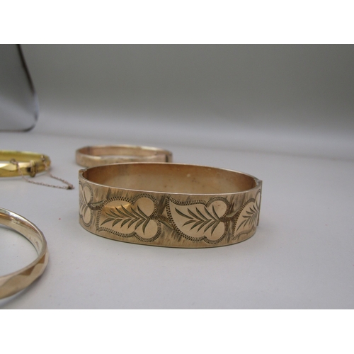 27 - Six gold plated/rolled gold bangles