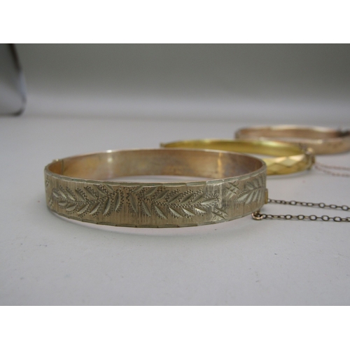 27 - Six gold plated/rolled gold bangles