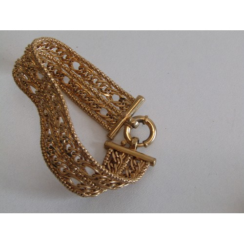 208 - 9ct gold multi layered woven design bracelet with spring ring clasp.
Length 7.5